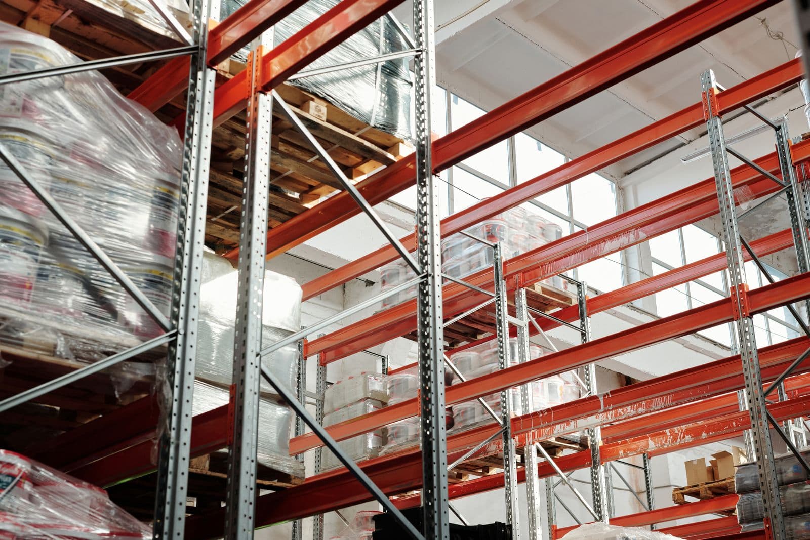 Warehouse pallet racking stocked with shrink-wrapped goods